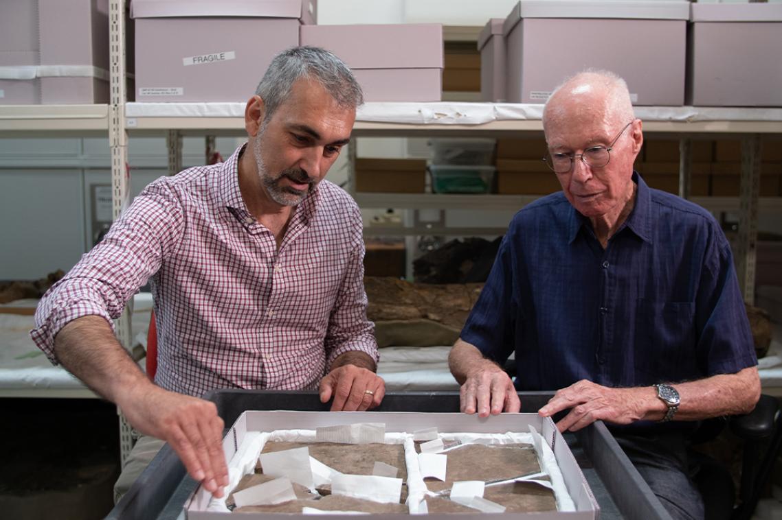 Dr Anthony Romilio and Honorary Professor Bruce Runnegar with the fossil Professor Runnegar found as a teenager.